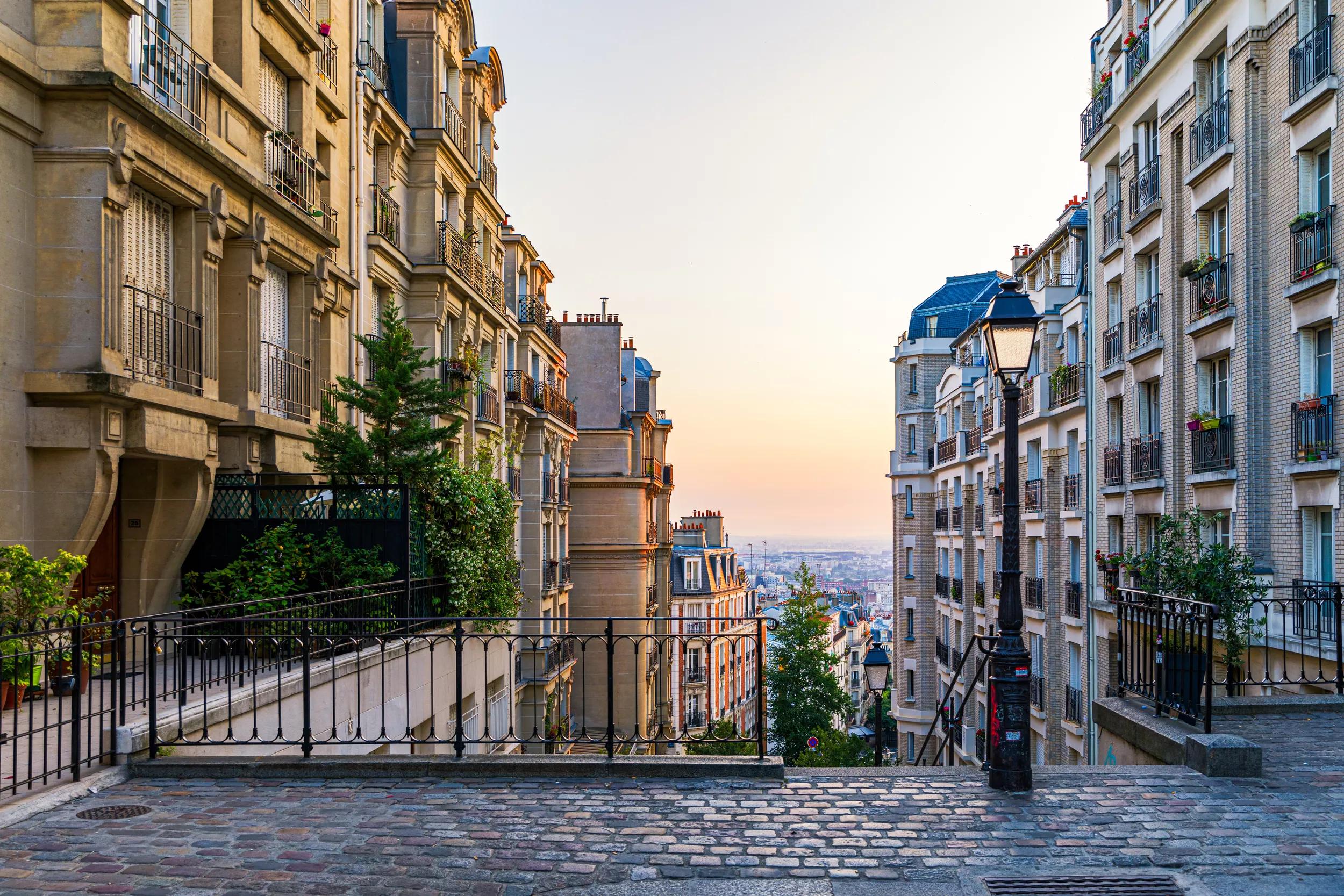 Montmartre district of Paris. Morning Montmartre staircase in Paris, France. Europa. View of cozy street in quarter Montmartre in Paris, France. Architecture and landmarks of Paris. Postcard of Paris.