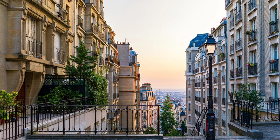 Montmartre district of Paris. Morning Montmartre staircase in Paris, France. Europa. View of cozy street in quarter Montmartre in Paris, France. Architecture and landmarks of Paris. Postcard of Paris.