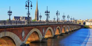 Bordeaux river bridge with St-Michel cathedral, France