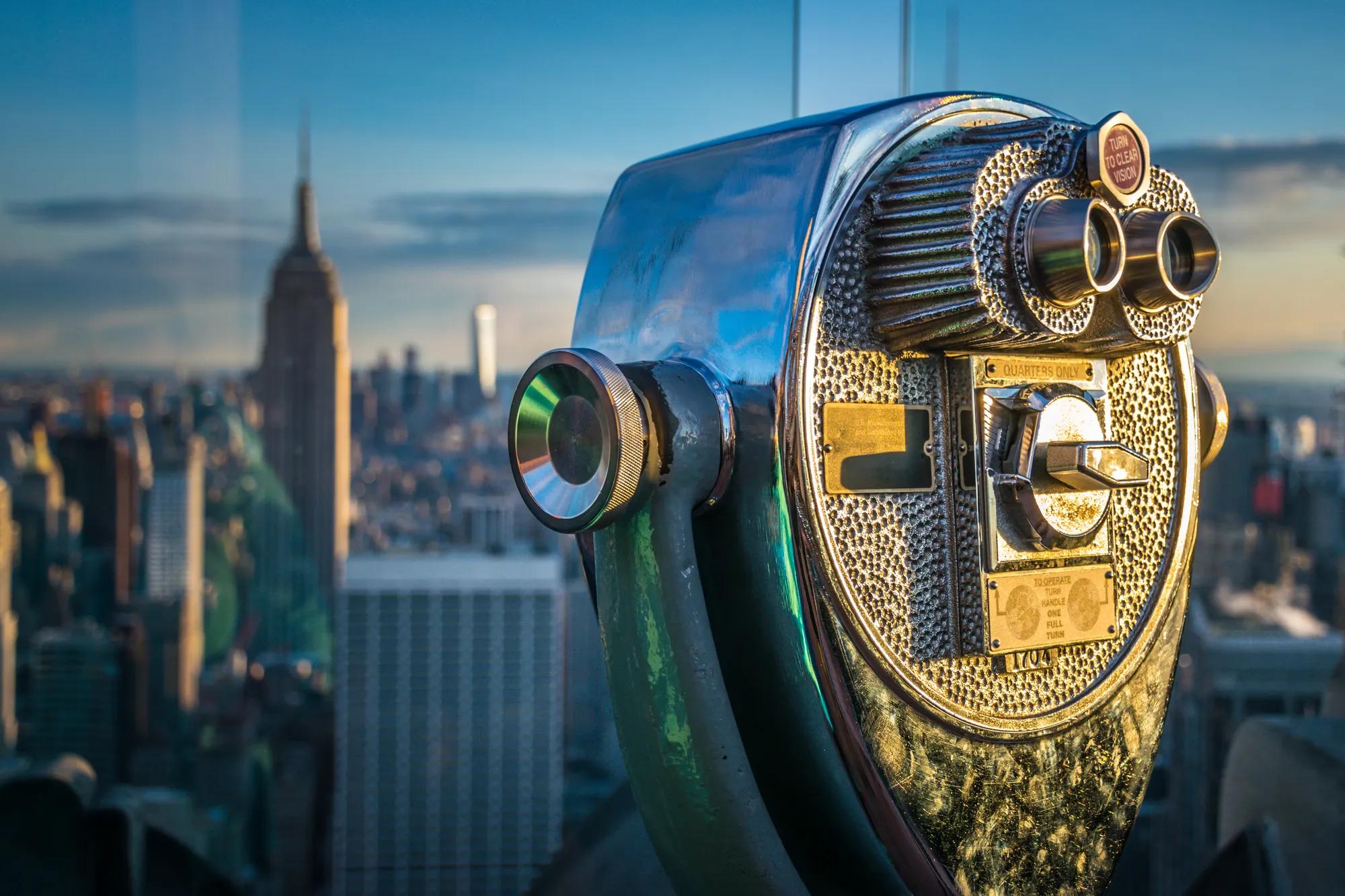 new york Top of the Rock binoculars with Empire State Building in the background