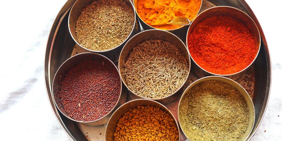 A variety of Indian spices, including red chili powder