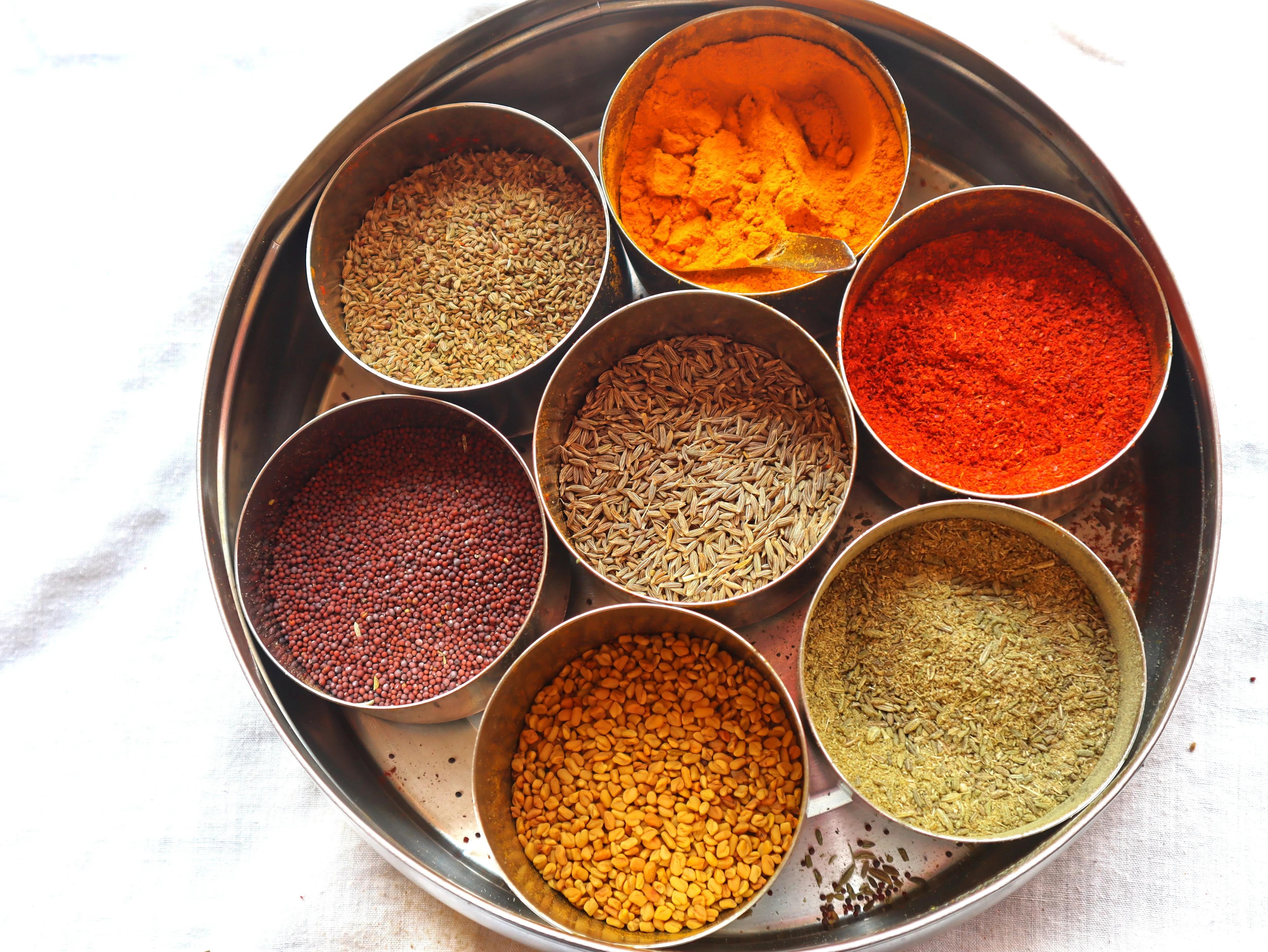 A variety of Indian spices, including red chili powder