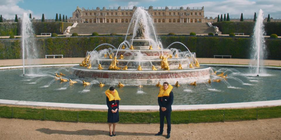 Crew in front of a fountain