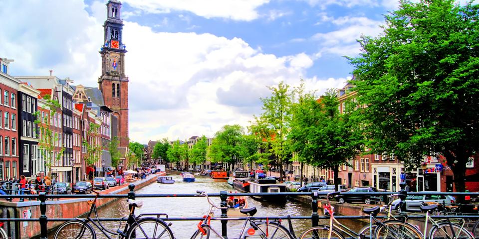 Bicycles lining a bridge over the canals of Amsterdam